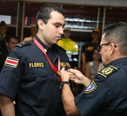 Fuerza Publica Officer Juan Carlos Flores Mena receives the Scarlet Cross after recovering from a gunshot wound. Officer  Flores shot and killed an armed  robbery suspect near the University of Costa Rica in Montes de Oca.